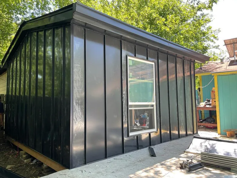 Black standing seam metal wall panels for Roof Inspection in Donna